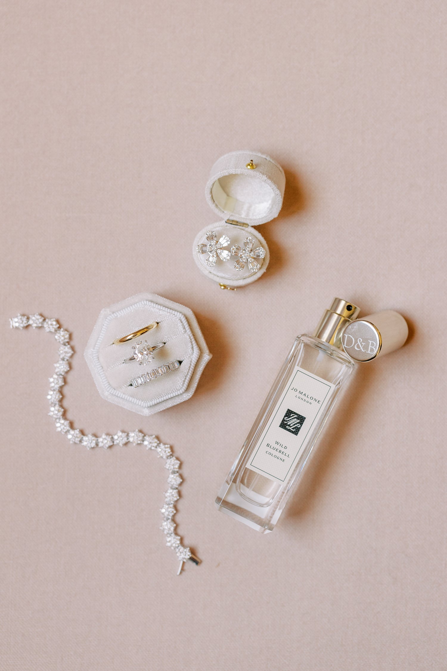 Flat lay photo by the ganeys featuring the georgian oval linen ring box and velvet octagon ring box in dove white