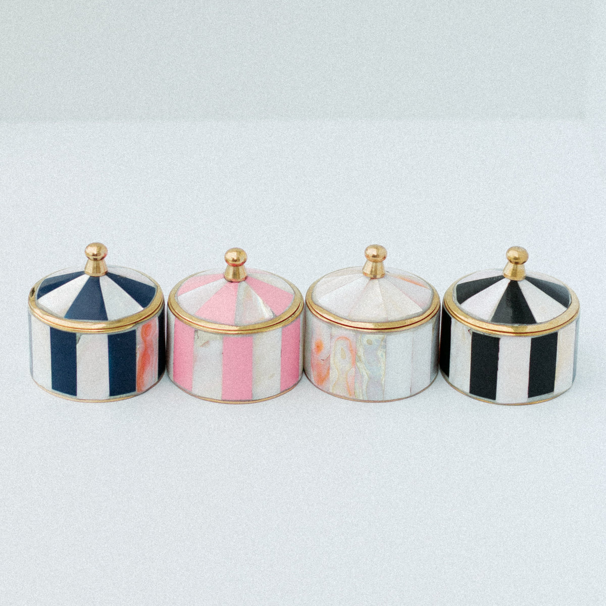 Whimsical striped mother of pearl ring boxes in navy, pink, ivory and black with gold-tone tops