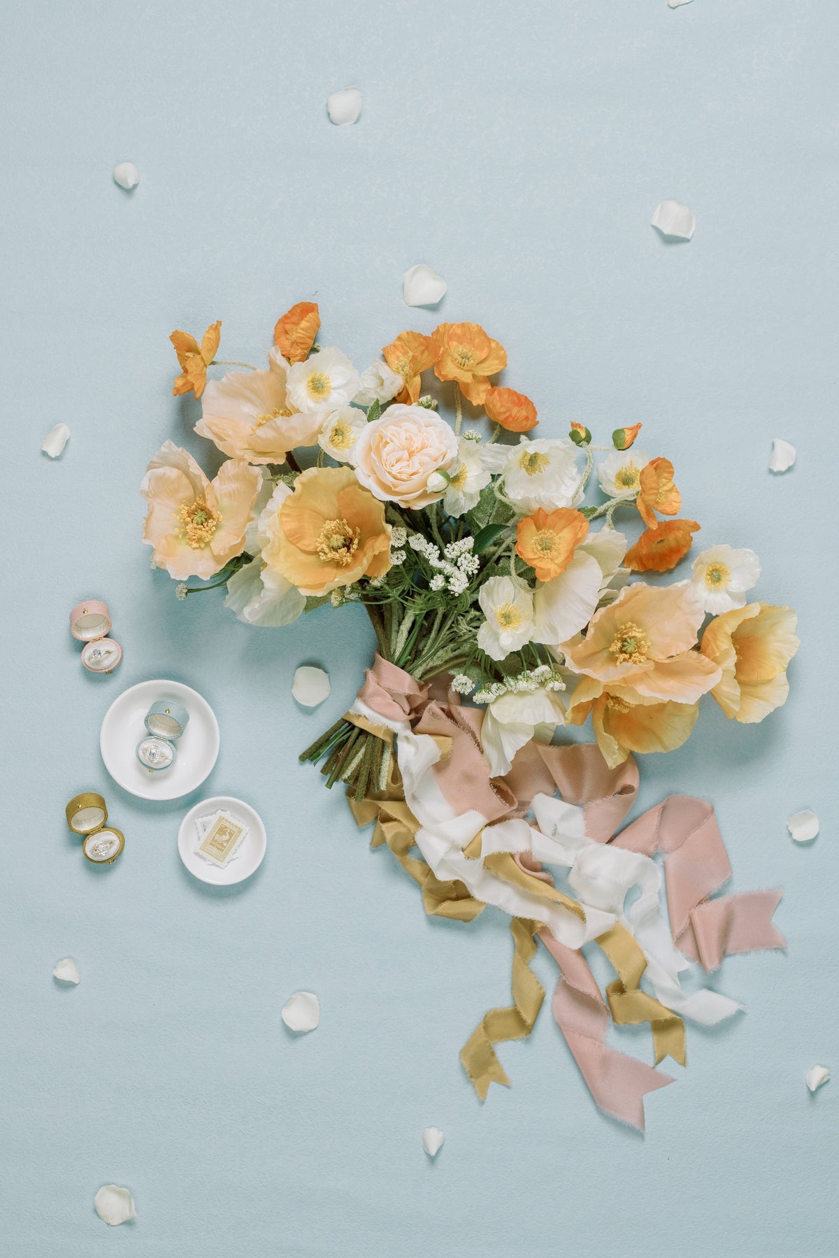 Peach bouquet with ribbon on blue and a Traverse Bay Georgian oval ring box
