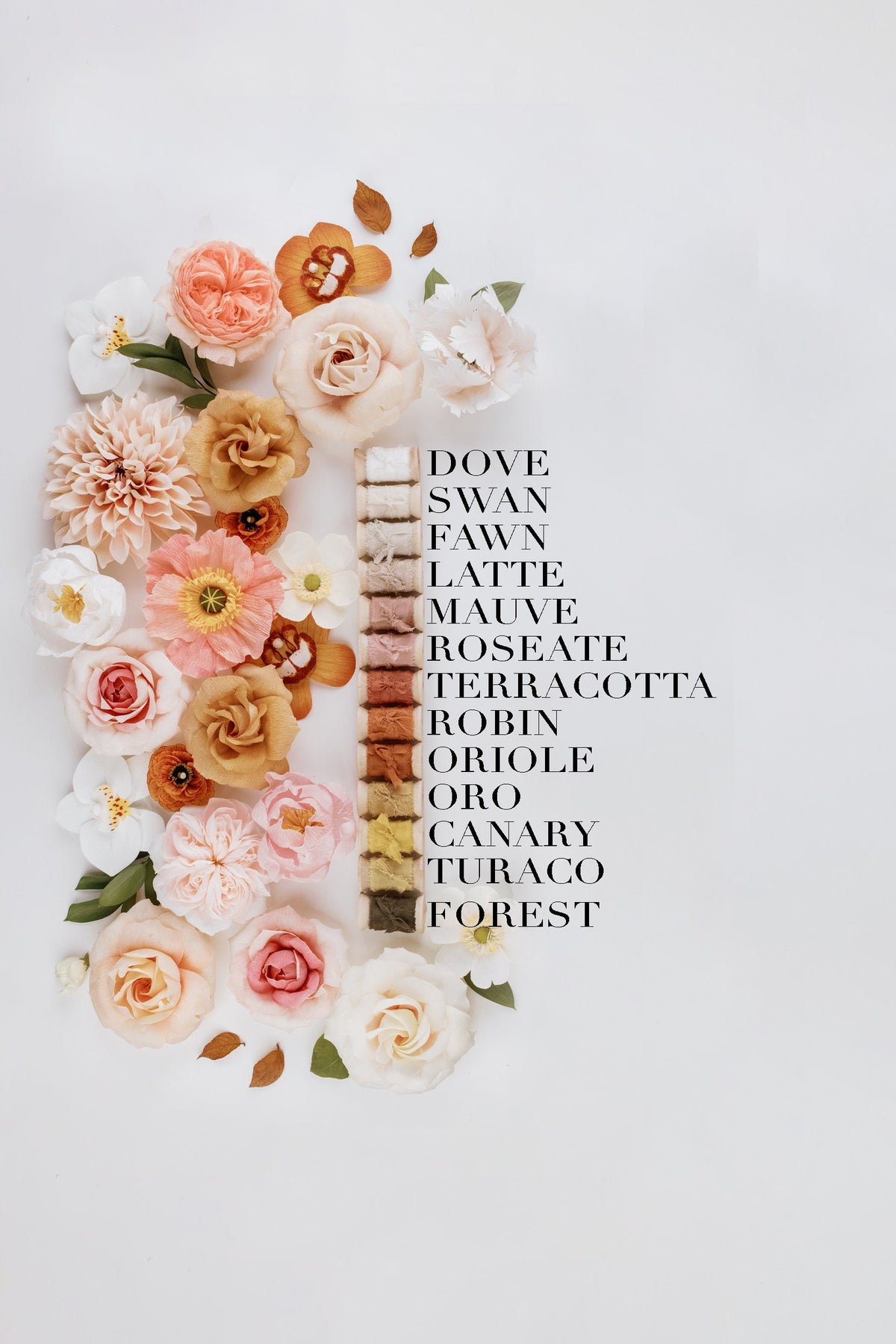 Silk ribbon color chart alongside a floral flat lay